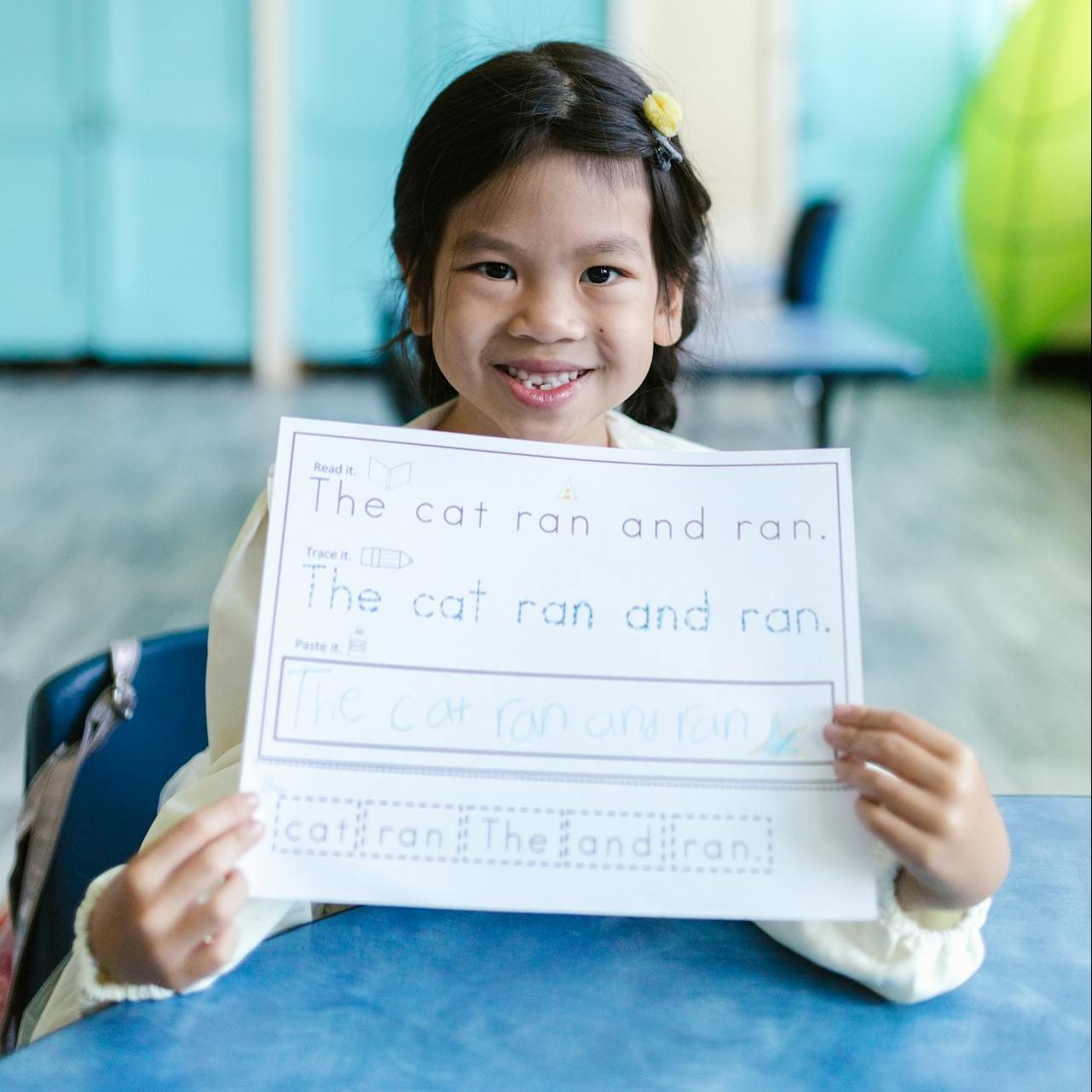 Girl Smiling while Holding Her Worksheet. Photo by RDNE Stock project: https://www.pexels.com/photo/girl-smiling-while-holding-her-worksheet-8363013/